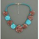 collier perles plates réversible transparent marron / fond turquoise fleur marron