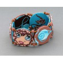 bracelet perles plates réversible fond turquoise fleur marron / visage fleur marron