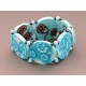 bracelet perles plates réversible fond turquoise clair fleur marron /  transparent turquoise