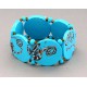 bracelet perles plates  fond turquoise fleur turquoise & marron