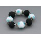 bracelet perles boules fond transparent fleur turquoise