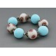 bracelet perles boules fond transparent fleur marron