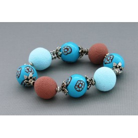 bracelet perles boules  fond turquoise fleur turquoise & marron