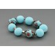 bracelet perles boules  fond turquoise clair fleur marron