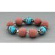 bracelet perles boules  fond turquoise fleur turquoise & marron